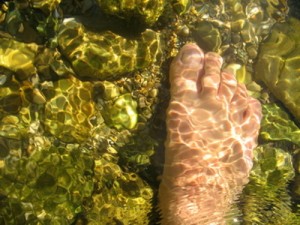 foot in river